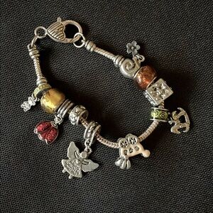 RMN Congrats it’s a baby charm bracelet. 10 baby charms. Silver. 8 inches